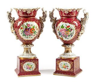 A Pair of German Porcelain Urns Height 18 1/2 inches.