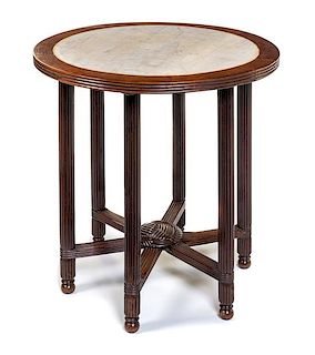 A Continental Walnut Table Height 30 x diameter of top 29 inches.