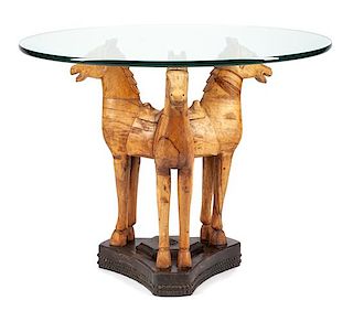 A Carved Wood and Glass Figural Table Height 30 1/2 x diameter of top 39 1/2 inches.