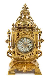 * A Continental Neoclassical Style Brass Mantel Clock Height 18 x width 8 1/2 x depth 6 inches.