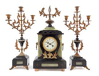 * A Continental Gilt Metal Mounted Onyx and Slate Clock Garniture Height of clock 20 1/2 x width 9 1/2 x depth 5 1/2 inches.