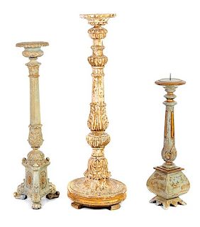 A Group of Three Painted Pricket Sticks Height of tallest 37 3/4 inches.