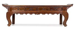 A Chinese Carved Walnut Altar Table Height 32 1/2 x width 108 x depth 18 1/2 inches.