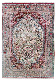 A Tabriz Wool Rug 7 feet 5 1/4 inches x 5 feet.