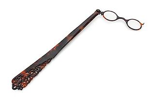 * A Victorian Carved Tortoise Shell Lorgnette Length 10 3/4 inches.