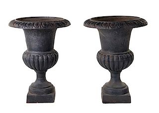 A Pair of Victorian Style Cast Iron Urns Height 31 inches.
