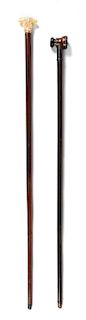 Two Continental Walking Sticks Length of longer 36 1/2 inches.
