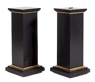 A Pair of Parcel Gilt Ebonized Pedestals Height 40 inches.
