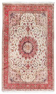 A Tabriz Wool and Silk Rug 9 feet 5 inches x 6 feet 5 inches.