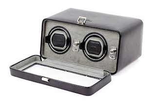A Wolf Dual Operation Watch Winder Height of case 8 x width 11 1/2 x depth 5 1/2 inches.