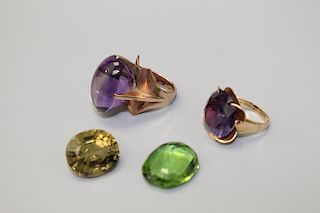 Two color stone rings and two cabochons.