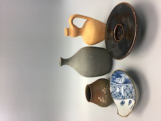 A group of Japanese pottery items.
