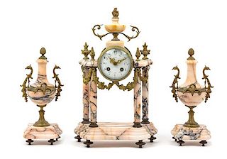 A French Gilt Bronze and Marble Clock Garniture Height of clock 16 1/2 inches.