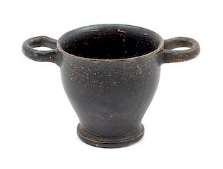 * A Greek Pottery Black Slip Decorated Wine Cup Diameter 5 1/2 inches.