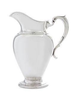 An American Silver Water Pitcher, Redlich & Co., New York, NY, Early 20th Century, of baluster form, raised on a circular foot.
