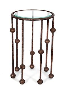 A Modern Wrought Iron Knot-Form and Glass Top Side Table Height 25 x diameter 15 inches.