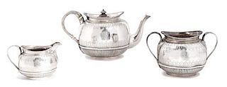 An English Silver Tea and Coffee Service, Elkington, Birmingham, 1888, comprised of a teapot, creamer and sugar, eng