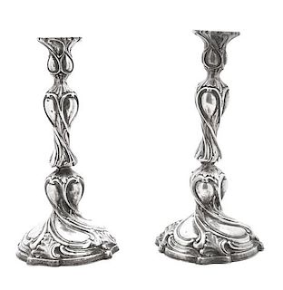 A Pair of Silver Candlesticks, Eastern European, Second Half 19th Century, Rococo style molded decoration of scrolls, rocaille a