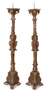 A Pair of Italian Giltwood and Mirrored Glass Torcheres Height 81 inches.