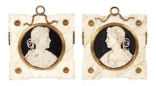 A Pair of Italian Carved and Painted Wood Cameo Plaques Height 25 x width 25 inches.