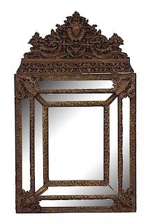 A Dutch Repousse Brass Cushion Mirror Height 51 x width 30 inches.