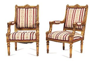 A Pair of Louis XIV Style Carved Giltwood Fauteuils Height 40 1/2 inches.