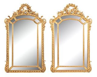 A Pair of Louis XV Style Carved Mirrors Height 75 x width 44 inches.