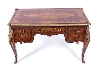 A Louis XV Style Gilt Bronze Mounted Marquetry Writing Table Height 32 1/2 x width 54 x depth 32 inches.