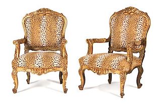 A Pair of Louis XV Style Carved Giltwood Fauteuils Height 43 1/2 inches.