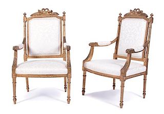 A Pair of Louis XVI Style Carved Giltwood Fauteuils Height 40 inches.