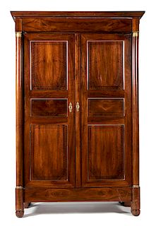 A French Empire Mahogany Armoire Height 90 x width 59 x depth 26 inches.