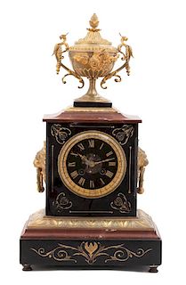 A French Empire Style Gilt Bronze Mounted Marble Mantle Clock Height 18 1/2 inches.