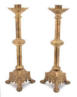 A Pair of Continental Molded Brass Torcheres Height 24 3/4 inches.