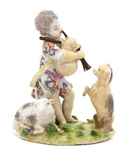 A Meissen Figure of a Putto with Bagpipes Watched by a Dog Height 5 1/2 inches.