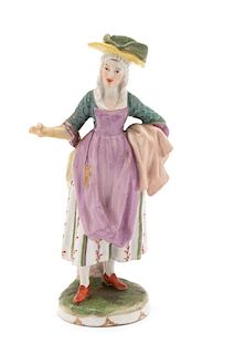 A Vienna Porcelain Figure of a Street Vendor Height 6 inches.