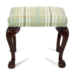 A George II Style Carved Mahogany Foot Stool Height 18 1/2 x width 22 x depth 18 1/4 inches.