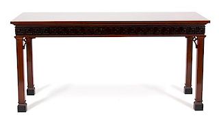 A Pair of Chinese Chippendale Style Carved Mahogany Hall Tables Height 35 x width 73 1/4 x depth 28 3/4 inches.