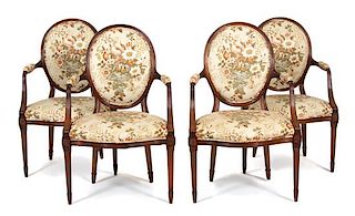 Four Regency Style Carved Walnut Open Armchairs Height 38 inches.