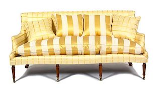 A Regency Style Silk Upholstered Sofa Height 37 x width 74 x depth 34 inches.
