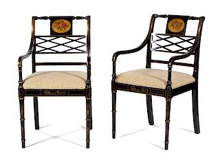 A Pair of Regency Style Ebonized and Parcel Gilt Open Armchairs Height 36 1/2 inches.