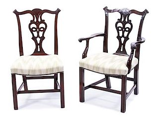 A Set of Twelve Hepplewhite Style Carved Mahogany Dining Chairs Height 37 1/2 inches.