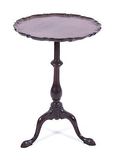A Chippendale Style Mahogany Tilt Top Tripod Table Height 26 x diameter 18 1/8 inches.