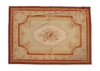 An Aubusson Style Needlepoint Rug 11 feet 11 inches x 8 feet 3 inches.