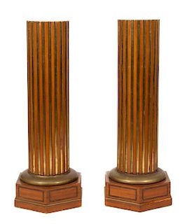A Pair of Walnut and Parcel Gilt Fluted Pedestals Height 40 inches.