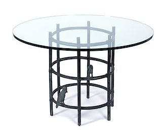 A Maitland-Smith Bronze Glass Top Table Height 29 x diameter 45 inches.