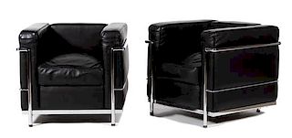 A Pair of Le Corbusier LC2 Petit Armchairs by Cassina Height 26 1/2 x width 30 x depth 28 inches.