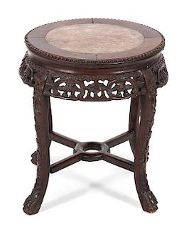 A Chinese Carved Hardwood Table with Inset Marble Top Height 19 x diameter 17 1/4 inches.