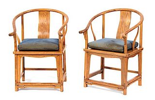 A Pair of Chinese Carved Hardwood Yoke Back Armchairs Height 39 inches.