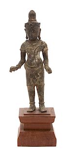 A Khmer Bronze Figure of a Standing Buddha Height 7 inches.