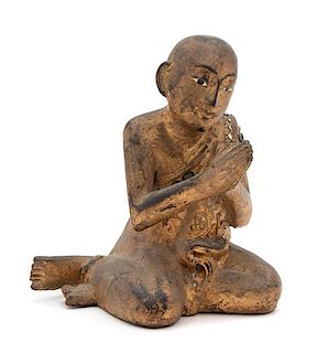 A Thai Lacquered Wood Figure of a Praying Monk Height 7 inches.